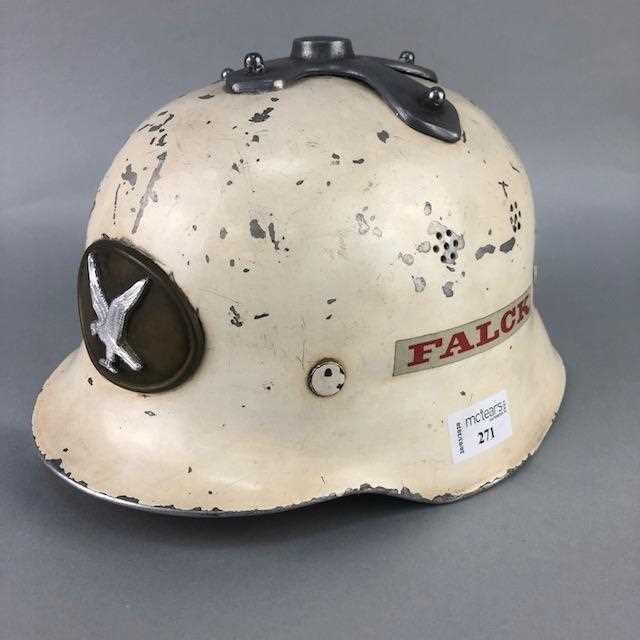 Lot 271 - A FALCK TIN FIREMAN HELMET