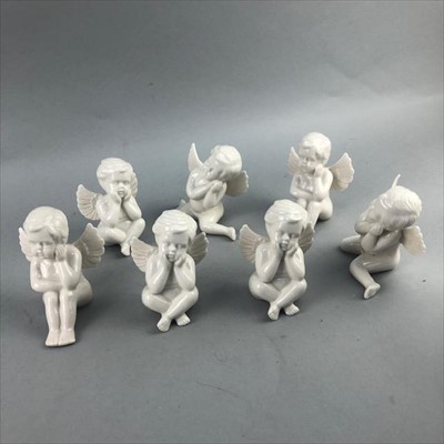 Lot 318 - A ROYAL DOULTON FIGURE OF 'TEATIME' AND SEVEN CERAMIC FIGURES OF CHERUBS