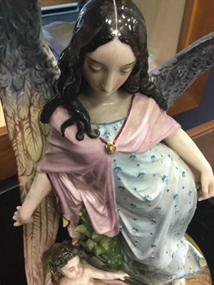 Lot 1053 - AN EARLY 20TH CENTURY CERAMIC FIGURE GROUP OF AN ANGEL AND CHRIST CHILD