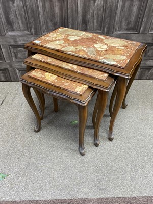 Lot 219 - A NEST OF THREE MARBLE TOPPED TABLES