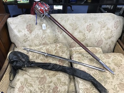 Lot 391 - A MILITARY DRESS SWORD WITH LEATHER SCABBARD