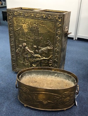 Lot 327 - A BRASS EMBOSSED STICK STAND AND A BRASS PLANTER