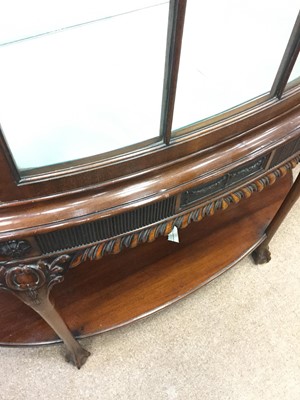Lot 1651 - A MAHOGANY BOW FRONT DISPLAY CABINETOF CHIPPENDALE DESIGN