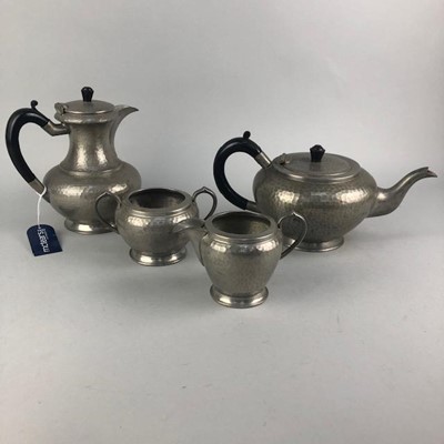 Lot 362 - A 20TH CENTURY HAMMERED PETWER FOUR PIECE TEA SERVICE