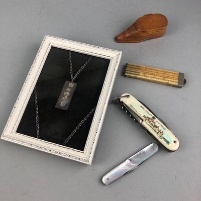 Lot 378 - A FRAMED SILVER INGOT PENDANT ON CHAIN, TWO PENKNIVES AND OTHER ITEMS