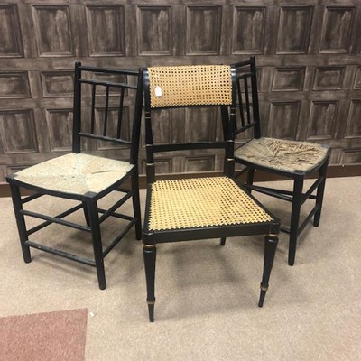 Lot 200 - A PAIR OF EBONISED DINING CHAIRS AND A CANE BACK HALL CHAIR