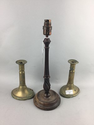 Lot 223 - A PAIR OF BRASS CANDLESTICKS AND CARVED WOOD TABLE LAMP