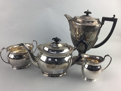 Lot 240 - A SILVER PLATED THREE PIECE TEA SERVICE AND A SILVER PLATED WATER JUG