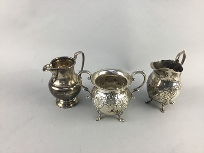 Lot 243 - A SILVER CREAM JUG AND A WHITE METAL SUGAR AND CREAM