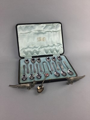 Lot 278 - A SET OF SILVER PLATED SPOONS AND TWO WHITE METAL MODEL BIRDS