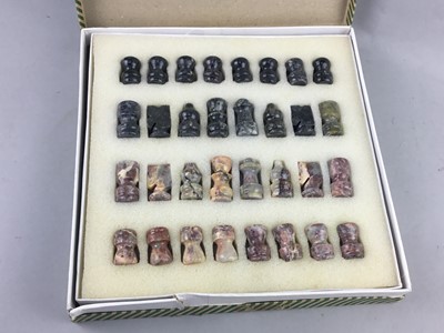 Lot 141 - A HARDSTONE MINIATURE CHESS SET