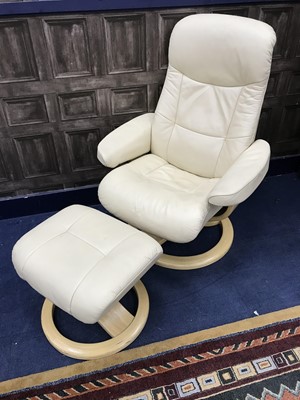 Lot 151 - A MODERN CREAM LEATHER ARMCHAIR WITH STOOL