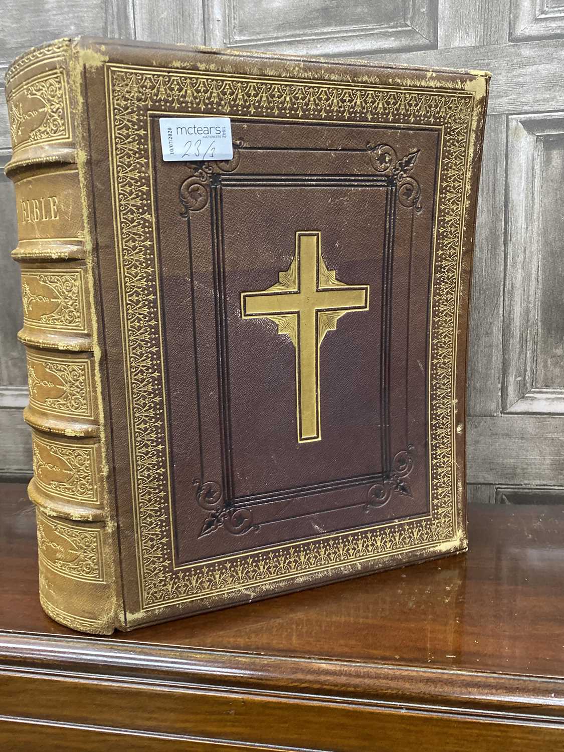 Lot 23 - A 19TH CENTURY LEATHER BOUND FAMILY BIBLE, AN ICON AND A PRINT