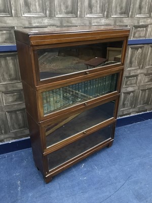 Lot 113 - AN EARLY 20TH CENTURY MAHOGANY SECTIONAL BOOKCASE AND BOOKS
