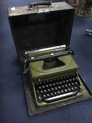 Lot 100 - A VINTAGE TYPEWRITER AND A CASED TAPE RECORDER