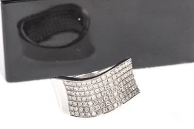Lot 1396 - A DIAMOND HALF ETERNITY RING