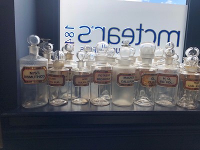 Lot 1057 - A LOT OF EARLY 20TH CENTURY CLEAR GLASS PHARMACEUTICAL BOTTLES
