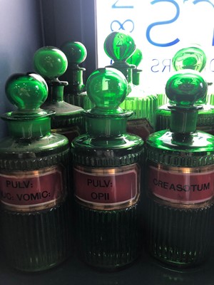 Lot 1058 - A LOT OF EARLY 20TH CENTURY GREEN GLASS PHARMACEUTICAL BOTTLES