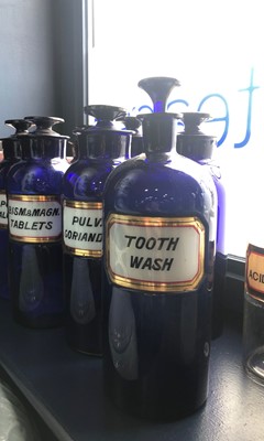 Lot 1059 - A LOT OF EARLY 20TH CENTURY BLUE GLASS PHARMACEUTICAL BOTTLES