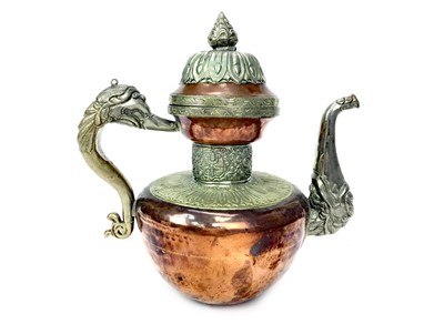 Lot 867 - A 20TH CENTURY TIBETAN COPPER AND WHITE METAL MOUNTED EWER