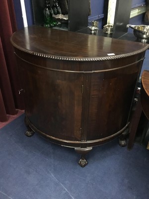 Lot 365 - A MAHOGANY DEMI LUNE SIDE CABINET