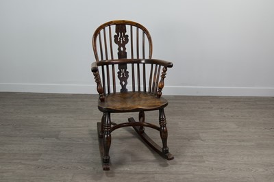 Lot 1210 - A 19TH CENTURY CHILDS' YEW-WOOD AND ELM WINDSOR ROCKING CHAIR