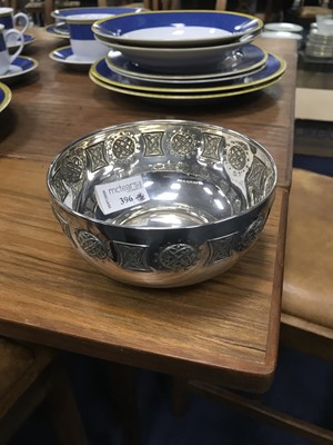 Lot 396 - A SILVER CIRCULAR BOWL WITH EMBOSSED CELTIC EMBLEMS