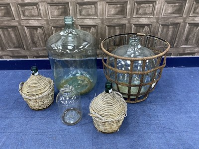 Lot 85 - A WROUGHT IRON CAGE, TWO GLASS CARBOYS AND THREE DEMI JOHNS