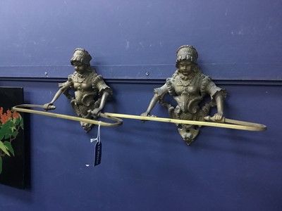 Lot 409 - A PAIR OF CAST BRASS WALL MOUNTING TOWEL HOLDERS