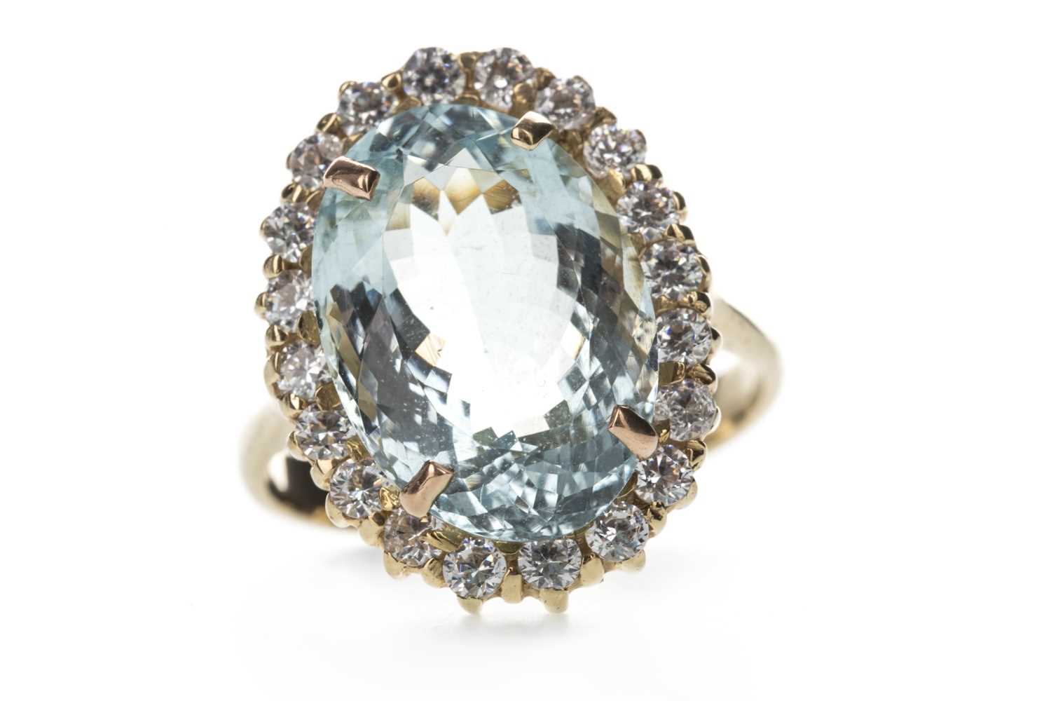 Lot 387 - AN AQUAMARINE AND CUBIC ZIRCONIA RING