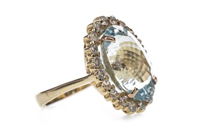 Lot 387 - AN AQUAMARINE AND CUBIC ZIRCONIA RING