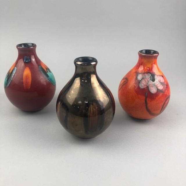 Lot 128 - A LOT OF SIX POOLE POTTERY SMALL GOURD SHAPED VASES