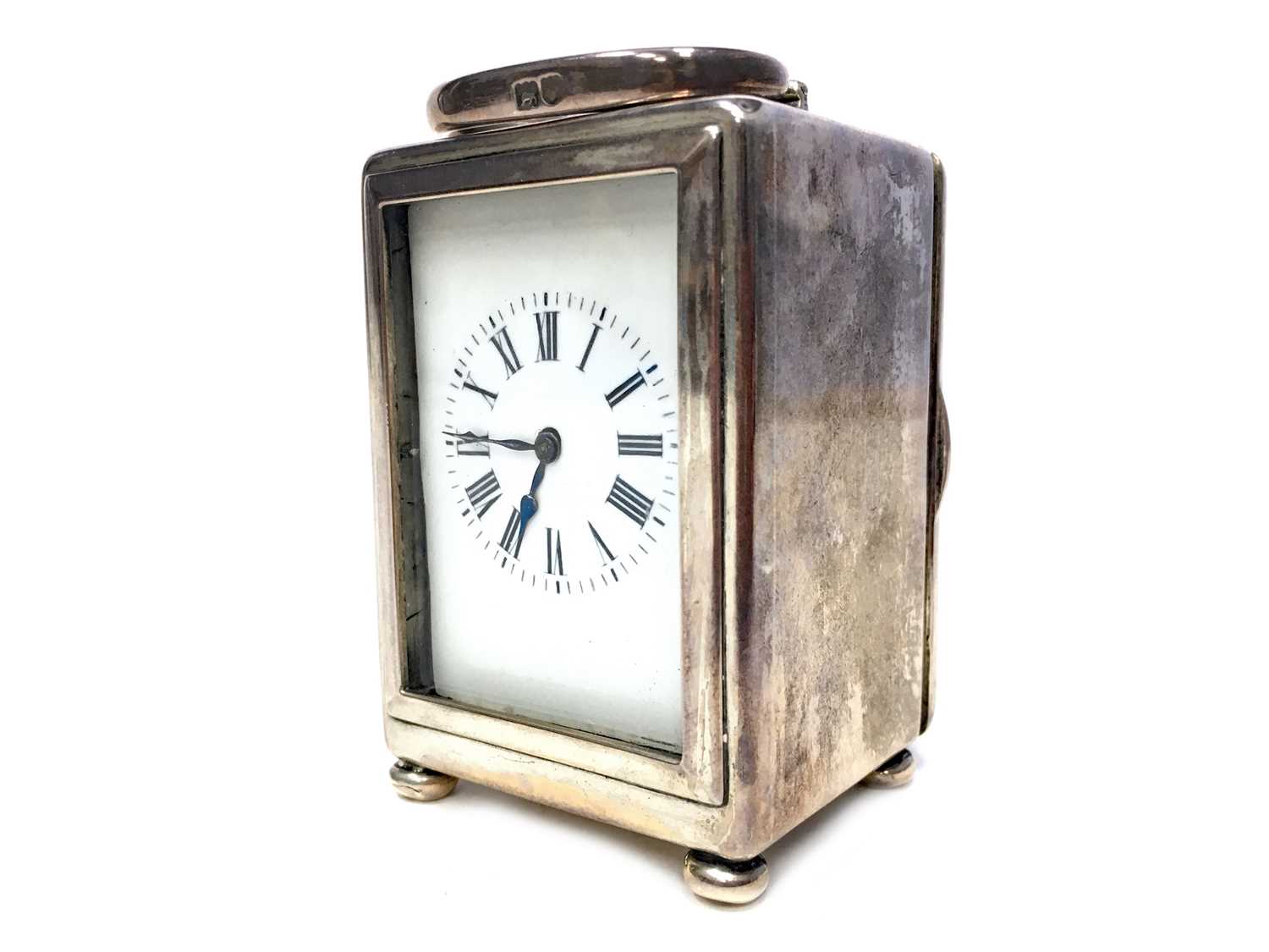Lot 1106 - AN EARLY 20TH CENTURY SILVER CASED MINIATURE CARRIAGE CLOCK