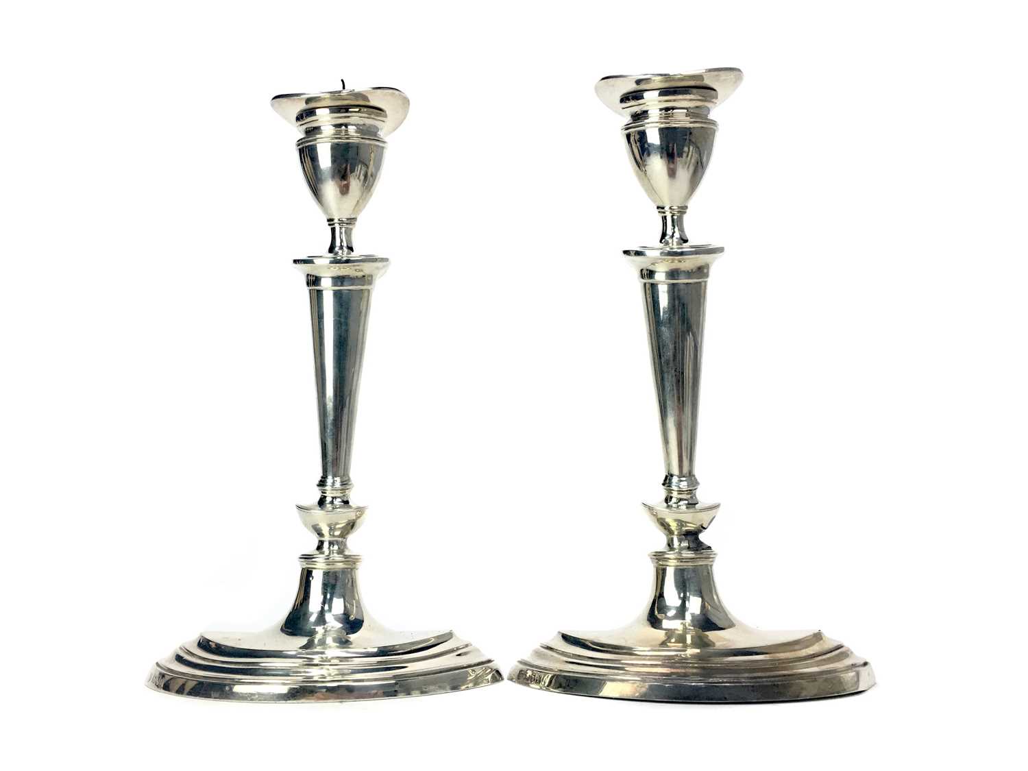 Lot 404 - A PAIR OF EDWARDIAN SILVER CANDLESTICKS