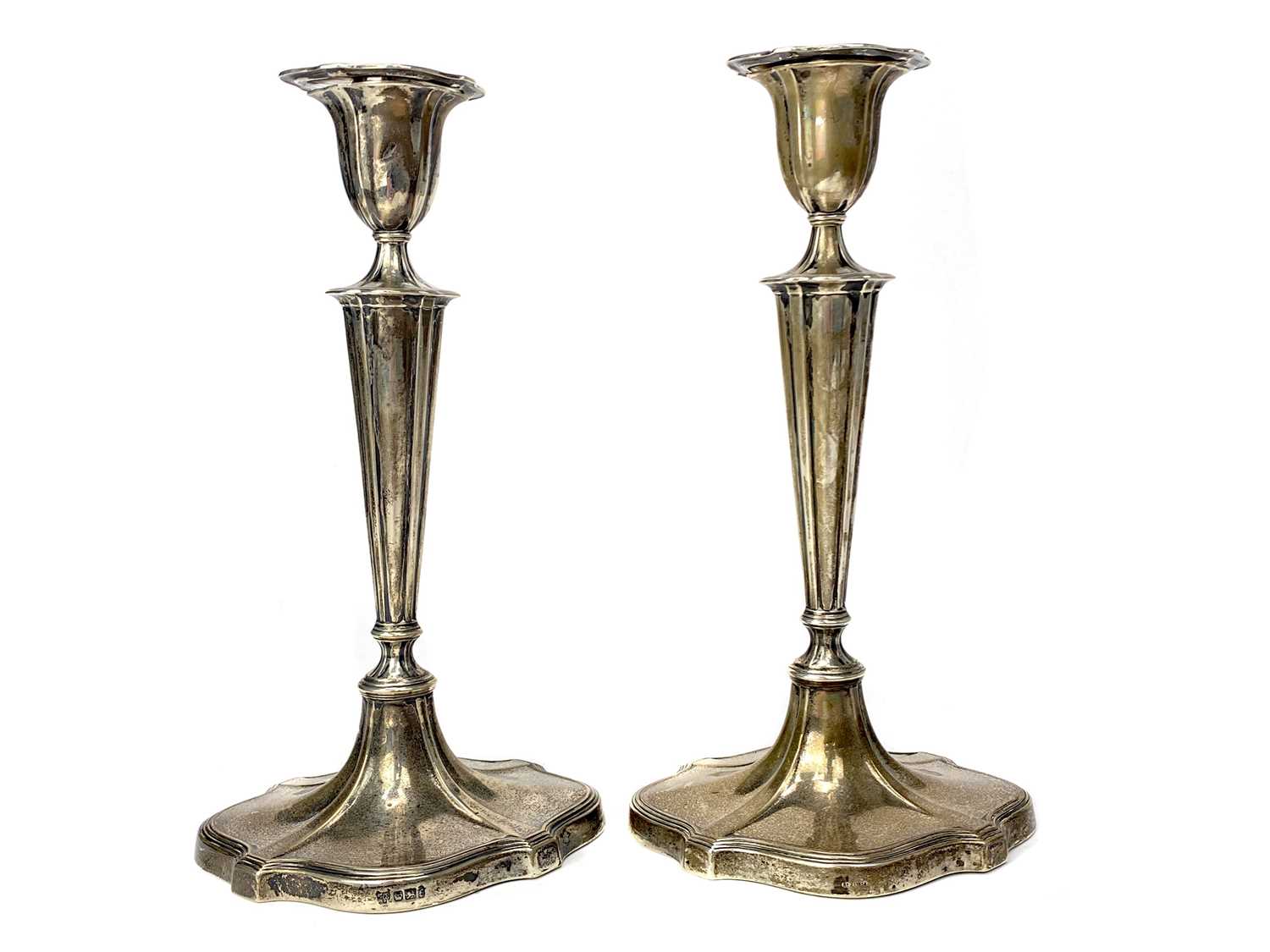 Lot 403 - A SET OF FOUR TABLE CANDLESTICKS OF NEOCLASSICAL DESIGN