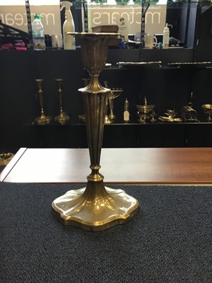 Lot 403 - A SET OF FOUR TABLE CANDLESTICKS OF NEOCLASSICAL DESIGN