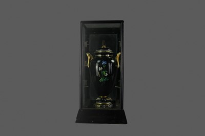 Lot 1307 - A VICTORIAN ENAMEL PAINTED BLACK GLASS DOUBLE HANDLED VASE AND COVER