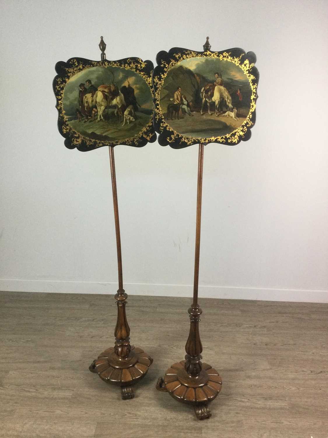 Lot 1297 - A PAIR OF EARLY VICTORIAN ROSEWOOD POLE-SCREENS