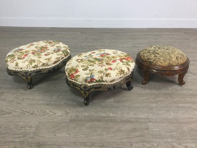 Lot 1354 - A PAIR OF VICTORIAN EBONISED OVAL  FOOTSTOOL OF ROCOCO DESIGN