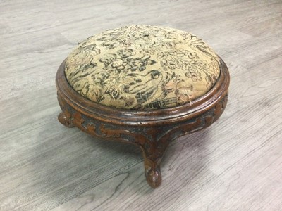 Lot 1354 - A PAIR OF VICTORIAN EBONISED OVAL  FOOTSTOOL OF ROCOCO DESIGN