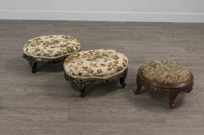 Lot 1354 - A PAIR OF VICTORIAN EBONISED OVAL  FOOTSTOOL OF ROCOCO DESIGN