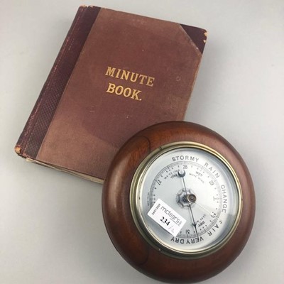 Lot 234 - A MAHOGANY CASED CIRCULAR WALL BAROMETER AND A MINUTE BOOK