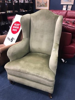 Lot 218 - AN UPHOLSTERED WING BACK ARMCHAIR