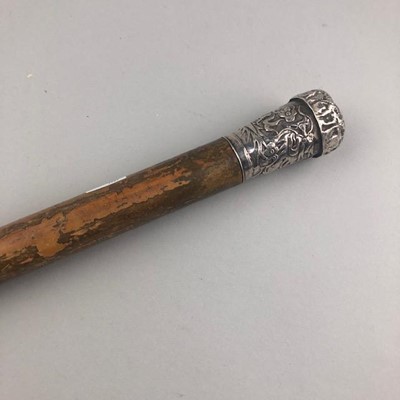 Lot 222 - A MALACCA CANE WITH EMBOSSED SILVER HANDLE