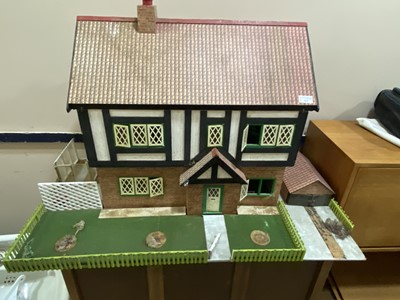 Lot 243 - A VINTAGE DOLLS HOUSE