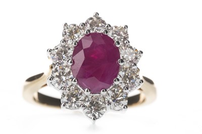 Lot 447 - A RUBY AND DIAMOND CLUSTER RING