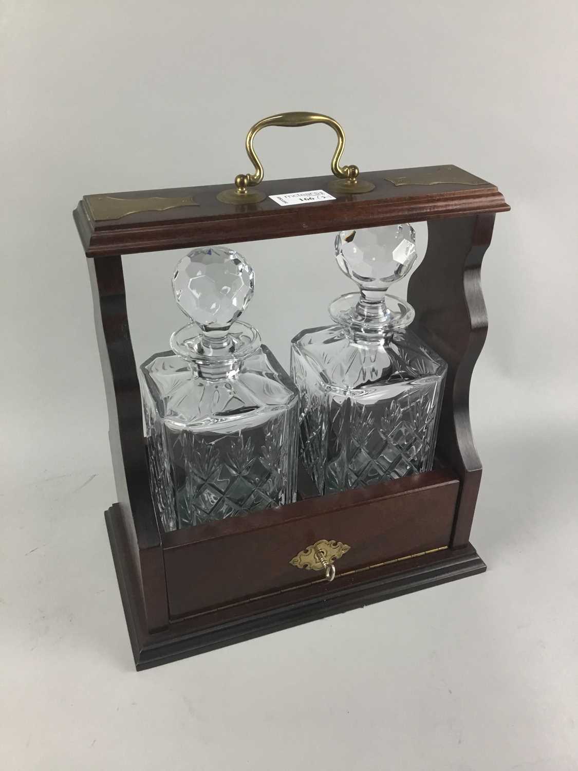 Lot 166 - A MAHOGANY TWO BOTTLE TANTALUS AND A BAROMETER