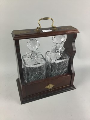 Lot 166 - A MAHOGANY TWO BOTTLE TANTALUS AND A BAROMETER