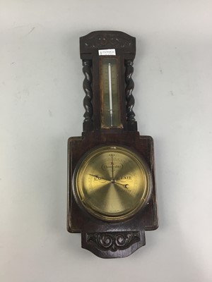 Lot 166 - A MAHOGANY TWO BOTTLE TANTALUS AND A BAROMETER