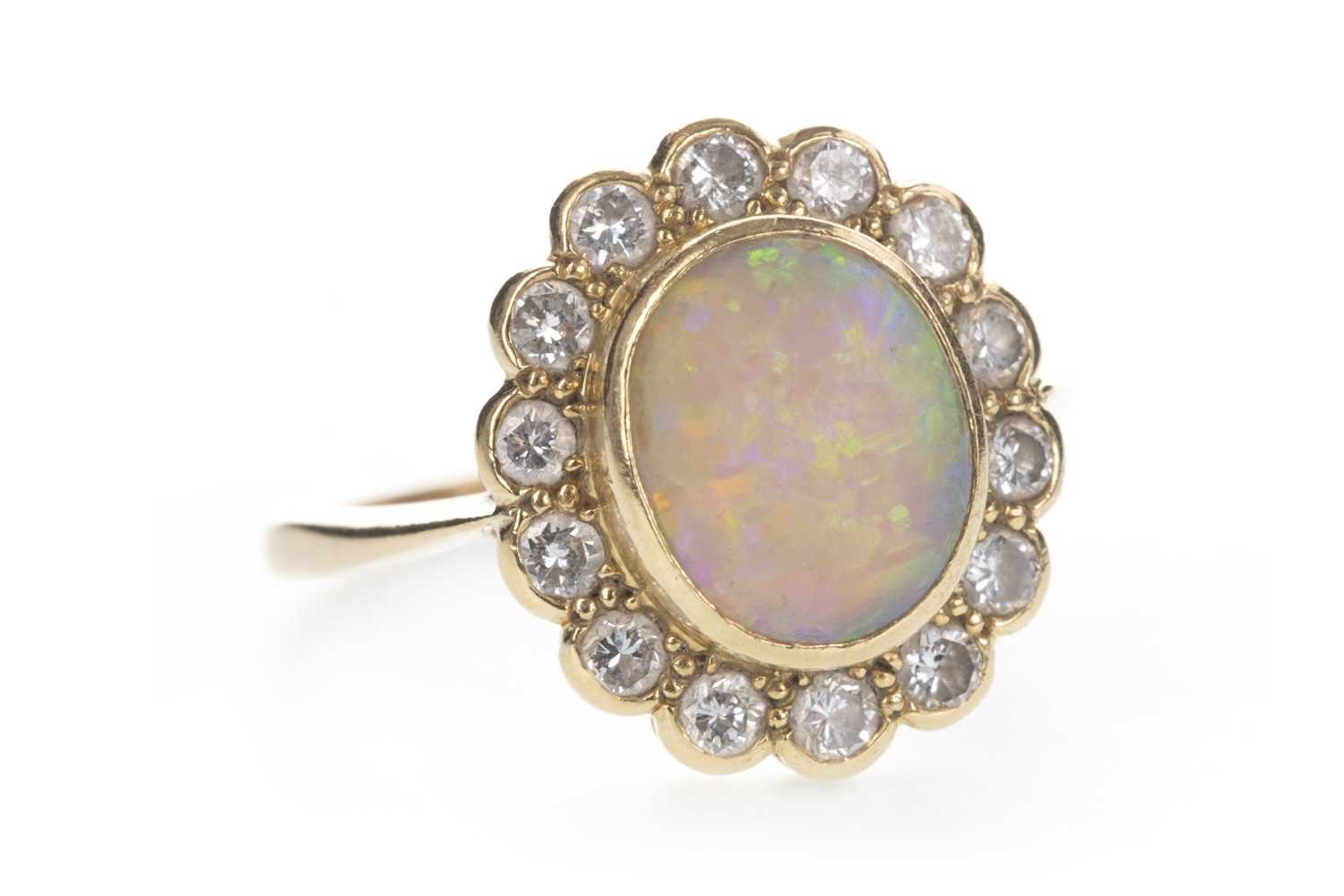 Lot 826 - AN OPAL AND DIAMOND RING
